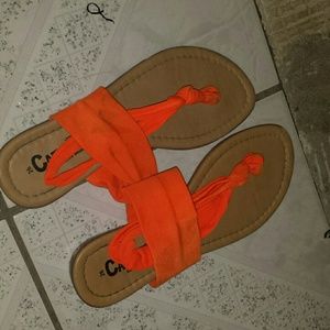 Some neon orange sandals